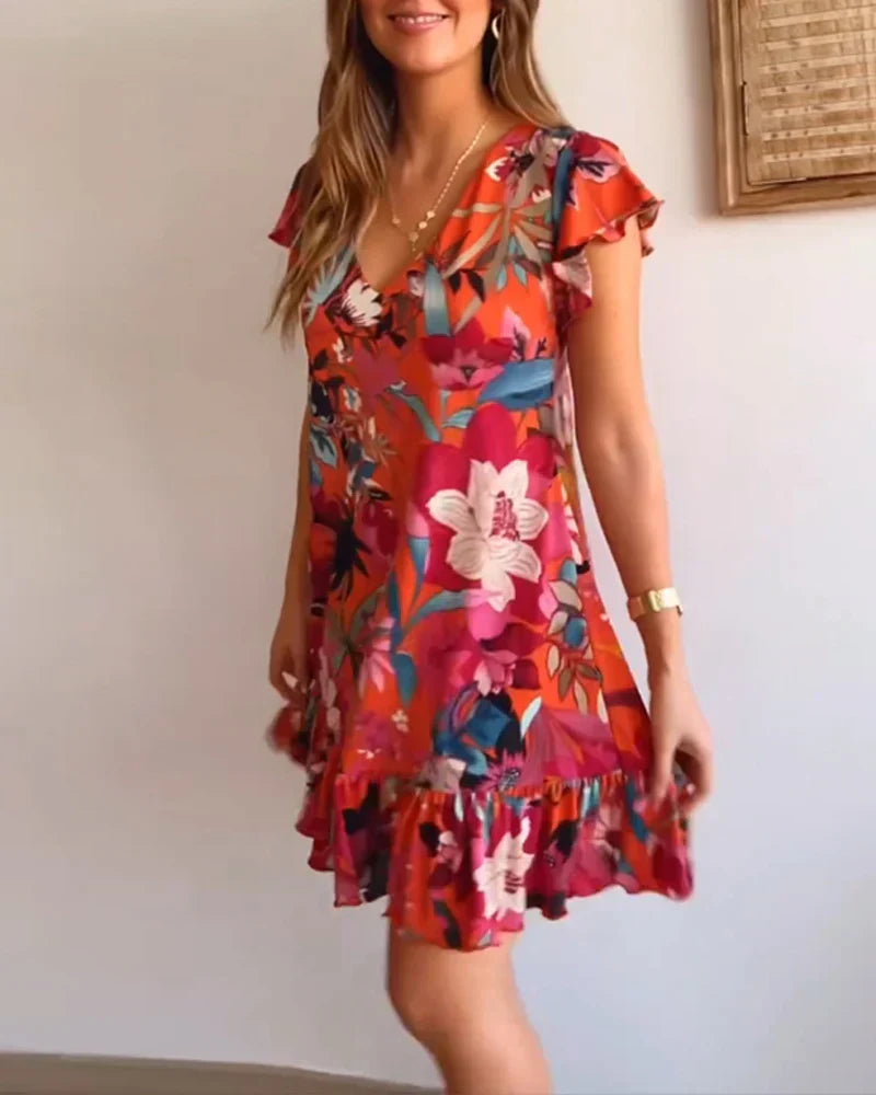 Vestido floral com babados e decote em V