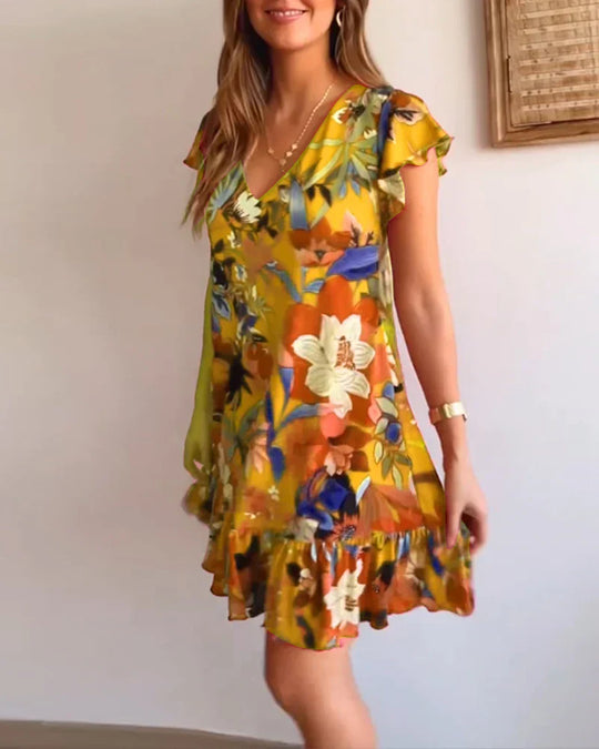 Vestido floral com babados e decote em V